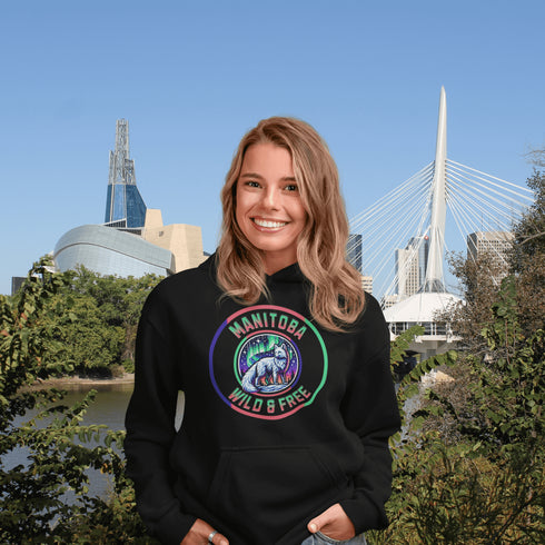 Unleash your wild side with our Manitoba – Wild & Free hoodie, featuring an enchanting graphic of an arctic fox beneath the dazzling northern lights.